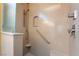 Walk-in shower with built-in seat and grab bar at 2778 Meadow Park Ave, Henderson, NV 89052