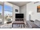 Living room with city views, large TV, and comfortable seating at 353 E Bonneville Ave # 1106, Las Vegas, NV 89101