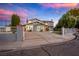 Two-story house with gray siding, landscaping, and gated entrance at 3531 W Arby Ave, Las Vegas, NV 89118