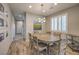 Dining room with round wooden table and six chairs at 5035 Fiery Sky Ridge St, Las Vegas, NV 89148