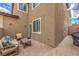 Spacious patio with seating and adjacent to the home's exterior at 5035 Fiery Sky Ridge St, Las Vegas, NV 89148