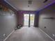 Bright bedroom with balcony access and LED lighting at 577 Leap Frog Ave, Las Vegas, NV 89183