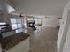 Combined kitchen and living area with tile floors and a fireplace at 577 Leap Frog Ave, Las Vegas, NV 89183