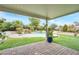 Covered patio overlooking a refreshing pool and waterfall feature at 789 Salt Flats Cir, Henderson, NV 89011