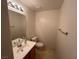 Clean bathroom with single sink vanity, toilet and bathtub at 10232 Keystone Pastures St, Las Vegas, NV 89183