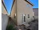 Tan two-story house with backyard access at 10232 Keystone Pastures St, Las Vegas, NV 89183