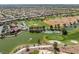 Golf course with a water feature and clubhouse at 10421 Linfield Pl, Las Vegas, NV 89134