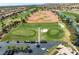 Aerial view of the golf course's driving range and parking area at 10421 Linfield Pl, Las Vegas, NV 89134