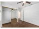 Bedroom with mirrored closet and ceiling fan at 10792 Spruce Bough St, Las Vegas, NV 89183