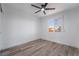 Well-lit bedroom featuring wood-look floors and a ceiling fan at 108 Appian Way, Henderson, NV 89002