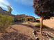 Landscaped backyard with gravel and covered patio at 128 Strone St, Henderson, NV 89012