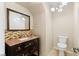 Updated bathroom with granite vanity and tile accents at 9421 Amber Valley Ln, Las Vegas, NV 89134