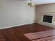 Living room with hardwood floors and fireplace at 9421 Amber Valley Ln, Las Vegas, NV 89134