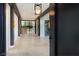 Bright entryway with modern light fixture and staircase at 10911 Discovery Peak Ct, Las Vegas, NV 89135