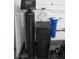 Garage with water softener and filter system at 1210 W Labrador St, Pahrump, NV 89048