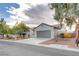 Single-story home with attached garage and nicely landscaped front yard at 2109 Alyssa Jade Dr, Henderson, NV 89052