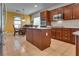 Spacious kitchen with island, stainless steel appliances, and wood cabinets at 2109 Alyssa Jade Dr, Henderson, NV 89052