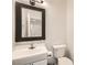 Clean bathroom with updated vanity and toilet at 2433 Olivewood St, Las Vegas, NV 89108