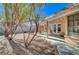 Landscaped backyard with gravel and trees at 2803 Tortoise Ct, Henderson, NV 89074