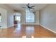 Spacious living room showcasing hardwood floors and a view of the kitchen at 445 Wright Way, Henderson, NV 89015