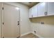 Laundry room with cabinets and exterior access at 4596 Brently Pl, Las Vegas, NV 89122