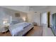 Bright bedroom featuring a king-size bed and ceiling fan at 5114 S Jones Blvd # 203, Las Vegas, NV 89118