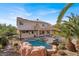 Two-story home with a pool, spa, and covered patio at 6192 Rocky Top Ave, Las Vegas, NV 89110