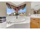 Relax in this bathroom with a corner soaking tub and mountain views at 6192 Rocky Top Ave, Las Vegas, NV 89110