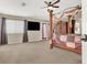 Spacious main bedroom with large bed and TV at 6192 Rocky Top Ave, Las Vegas, NV 89110