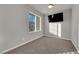 Cozy bedroom with a window and mounted TV at 8256 Dover Canyon Ct, Las Vegas, NV 89139