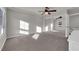 Bright bedroom featuring mirrored closet doors and ceiling fan at 8256 Dover Canyon Ct, Las Vegas, NV 89139