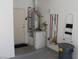 Garage with water heater, storage and cleaning supplies at 8788 Seal Rock Ct, Las Vegas, NV 89147