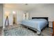 Bright bedroom with a queen-size bed and ample floor space at 933 Rockview Dr # 202, Las Vegas, NV 89128