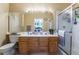 Bathroom with double vanity, large mirror, and shower at 170 Lovett Rd, Henderson, NV 89015