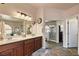 Double vanity bathroom with a large mirror and separate shower at 2234 Dillons Cove Dr, Laughlin, NV 89029