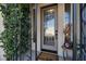 Elegant front door with glass panels and wrought iron accents at 2721 Crystal Beach Dr, Las Vegas, NV 89128