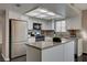 Galley kitchen with stainless steel appliances and granite countertops at 352 Dockside Ct, Las Vegas, NV 89145