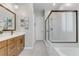 Modern bathroom with a frameless shower, stylish tile and double vanity at 372 Cooper Hawk Ct, Las Vegas, NV 89138