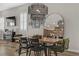 Bright dining room features a wood table, green chairs, and a large mirror at 372 Cooper Hawk Ct, Las Vegas, NV 89138