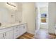 Modern bathroom with double vanity, marble countertops, and walk-in shower at 5290 Fairmont St, Pahrump, NV 89061