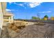 Large backyard with desert landscaping and block wall at 5471 Lincolnwood Ct, Pahrump, NV 89061