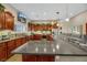 Gourmet kitchen boasting granite countertops and modern cabinetry at 647 Foxhall Rd, Henderson, NV 89002