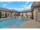 Stunning pool with a waterfall feature and comfortable seating at 647 Foxhall Rd, Henderson, NV 89002