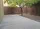 Small backyard with gravel and tree at 7173 Las Colinas Ave, Las Vegas, NV 89179