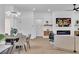 Dining area with a round table and stylish chairs adjacent to the living room at 10301 Long Leaf Pl, Las Vegas, NV 89134