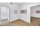 Bright hallway with wood-look floors and access to other rooms at 10901 Black Ledge Ave, Las Vegas, NV 89134