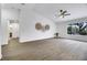 Bright living room featuring wood-look floors and large window at 10901 Black Ledge Ave, Las Vegas, NV 89134