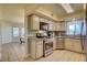 Kitchen boasts stainless steel appliances and light wood cabinets at 1433 Pueblo, Boulder City, NV 89005