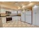 Bright kitchen features white cabinets, stainless steel appliances, and tile flooring at 1433 Pueblo Dr, Boulder City, NV 89005