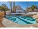 Relaxing pool area with palm trees and seating at 1704 Pinion Mesa Ct, Las Vegas, NV 89128